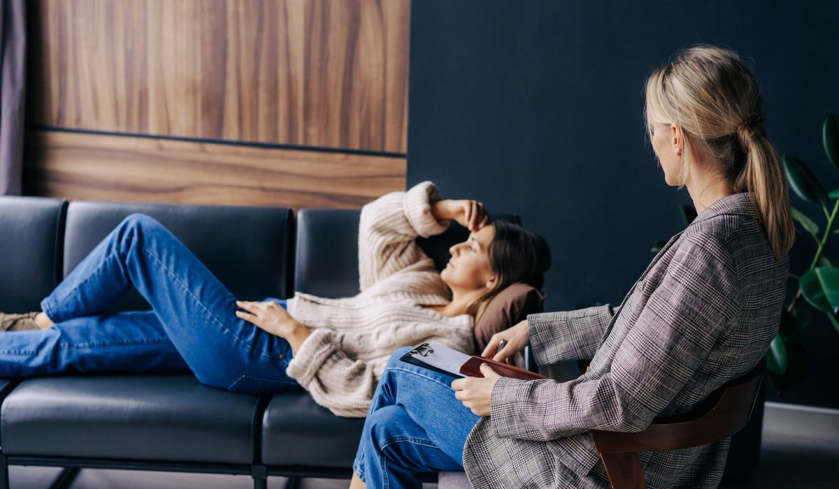 Woman lying on the couch in a therapy session.