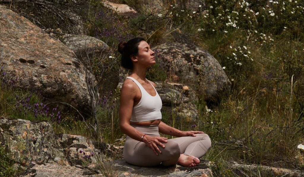 woman finding balance in life with nature