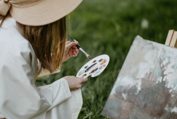 Woman inviting the trickster archetype in for creativity.