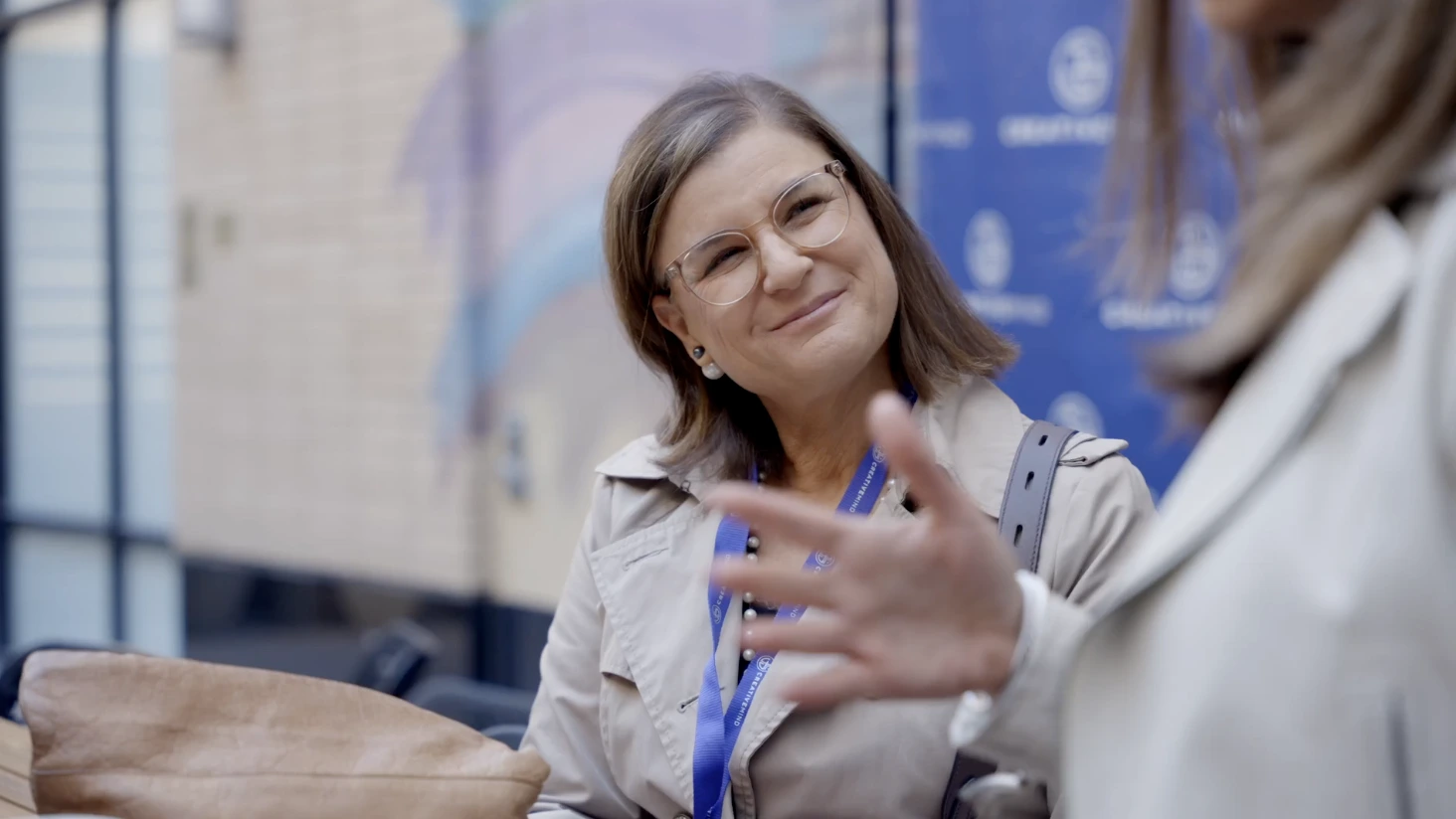 lady smiling while talking to someone