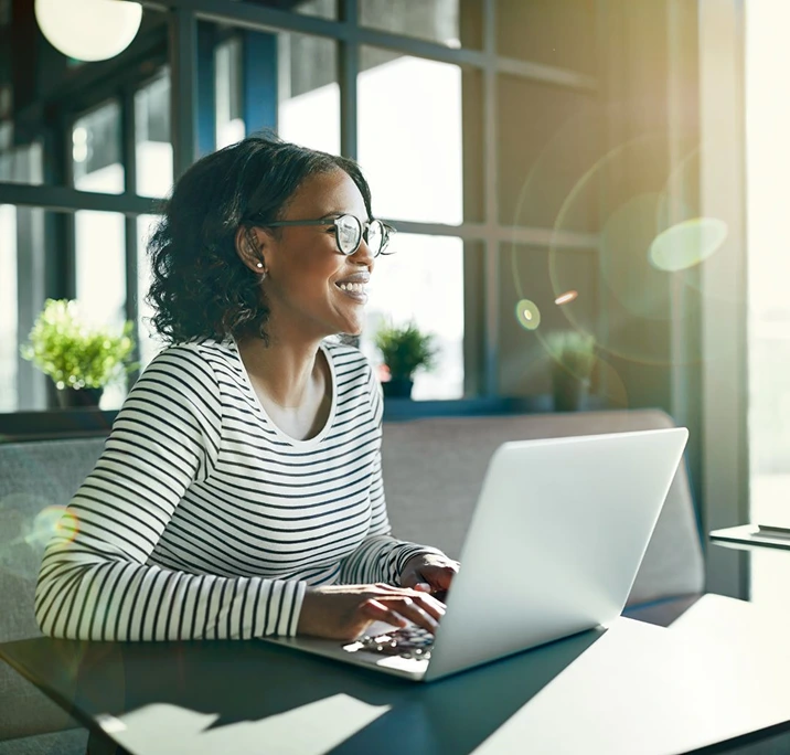woman using her laptop for an online exam